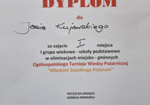 Dyplom dla Jana Kujawskiego za zajęcie I miejsca w Ogólnopolskim Turnieju Wiedzy Pożarniczej