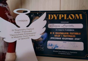 Dyplom za zajęcie I - go miejsca w IV Regionalnym Festiwalu Kolęd i Pastorałek „Opoczyńskie Kolędowanie 2026”